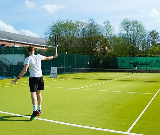 Man on a court playing tennis